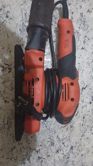 Lijadora eléctrica naranja y negra