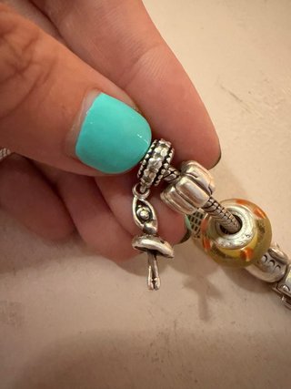 Pulsera Pandora con charms plata y amarillo
