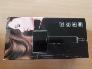 Rizador de pelo negro y dorado