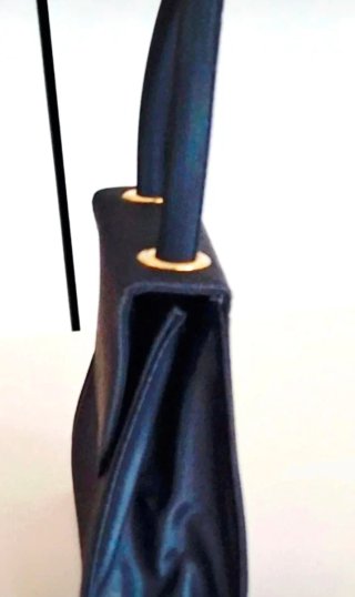 Borsetta Max Factor nera con dettagli oro