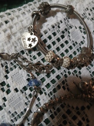 Tris braccialetti Sterling e acciaio con charme