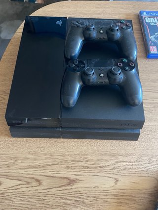 PS4 (PlayStation 4) con 2 mandos y juegos