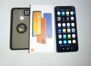 Xiaomi Redmi 9C con funda y caja