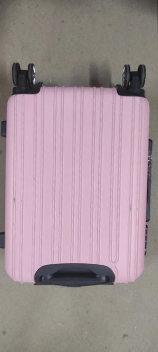 Maleta rosa de viaje