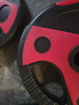 Barra y discos de pesas gimnasio