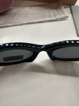 Gafas de sol Miu Miu Negras y Doradas Mujer