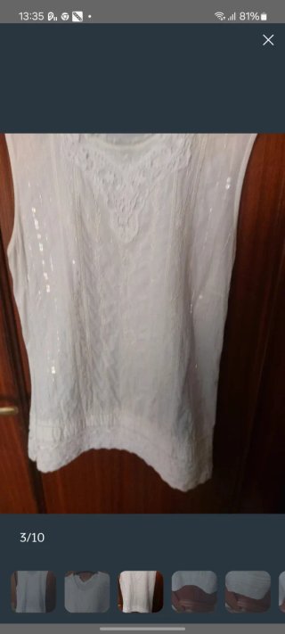 Blusa sin mangas Cortefiel color crema.