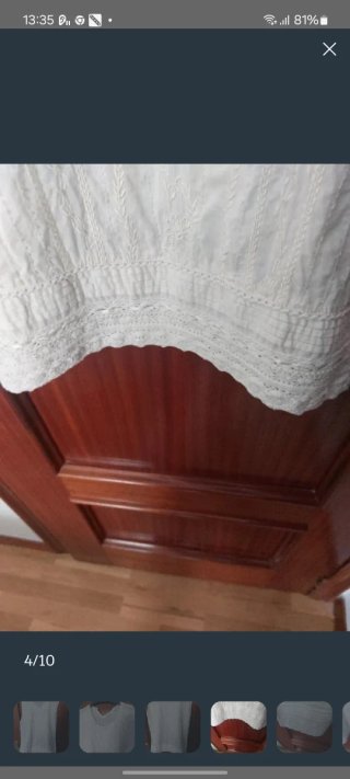 Blusa sin mangas Cortefiel color crema.