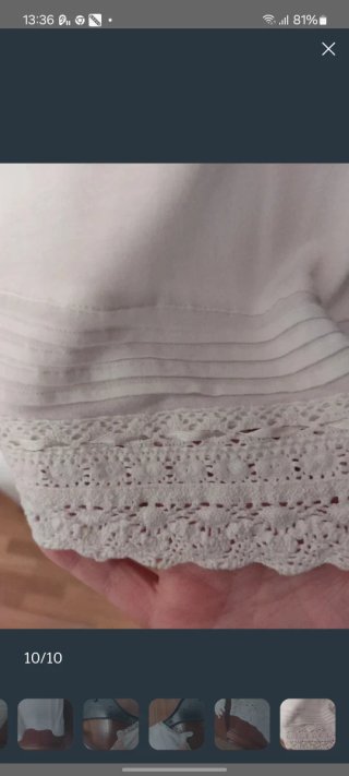 Blusa sin mangas Cortefiel color crema.