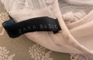 Top smanicato bianco