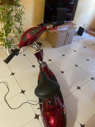 Patinete eléctrico con cargador,batería gastada