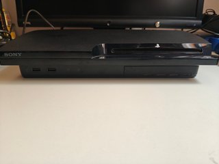 PlayStation 3 con 4 mandos y 5 juegos