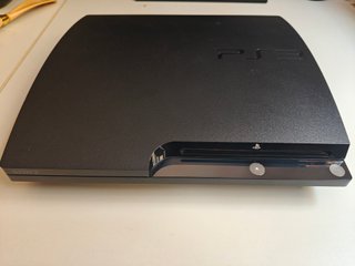PlayStation 3 con 4 mandos y 5 juegos