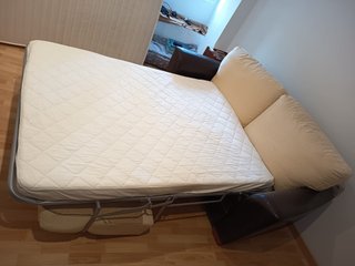 Sofá cama Suinta en tela y cuero