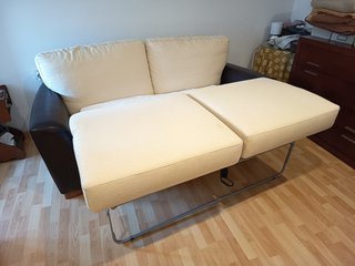 Sofá cama Suinta en tela y cuero