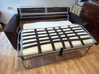 Sofá cama Suinta en tela y cuero
