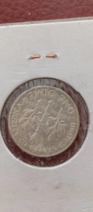 Monete in argento di George V e Roosevelt