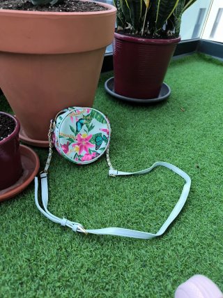 Bolso Guess Girl redondo estampado floral