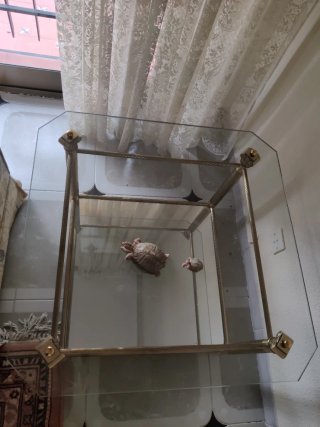 Mesa de centro cristal y metal dorado