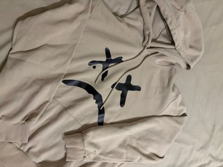 Sudadera beige con estampado Sad.