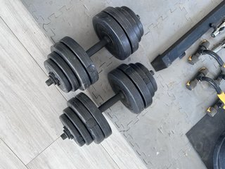 Rack gimnasio con banco, barra y discos