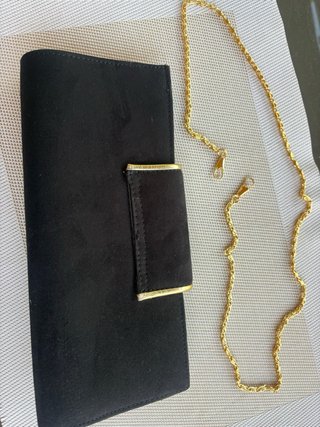 Bolso de fiesta negro con ribete dorado