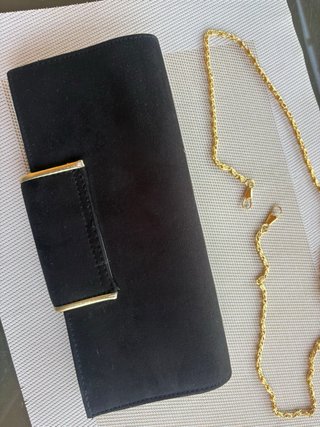 Bolso de fiesta negro con ribete dorado