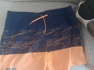 Bañador Olaian azul y naranja estampado