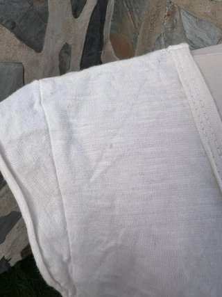 Camiseta boho blanca con crochet y flecos