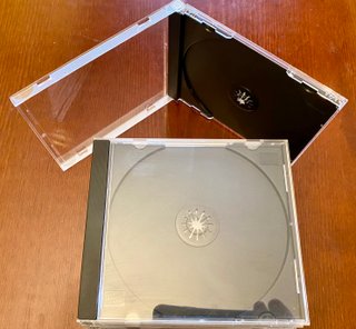 10 Custodie CD/DVD Nere + 1 Trasparente omaggio