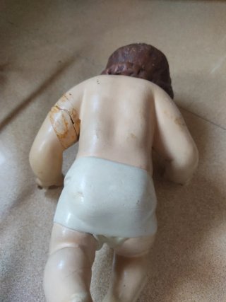 Niño Jesús vintage en cuna de ramas