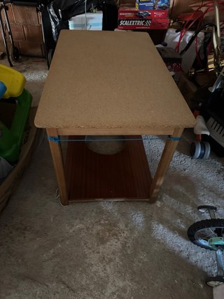Mesa de madera con hueco para brasero