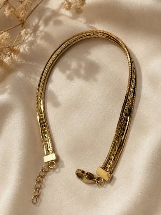 Pulsera dorada 14K con diseño trenzado