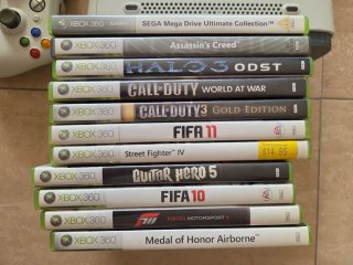 Consola Xbox 360+3mandos+guitarra+juegos