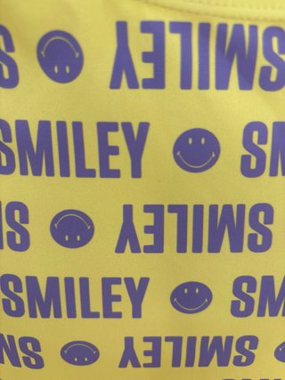 Triquini Smiley wordl