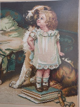 Cuadro punto de cruz niña y perro con marco