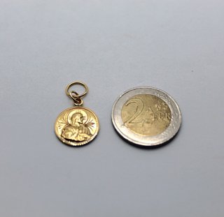 Medalla de oro de 18k. Peso: 2.37 gr.