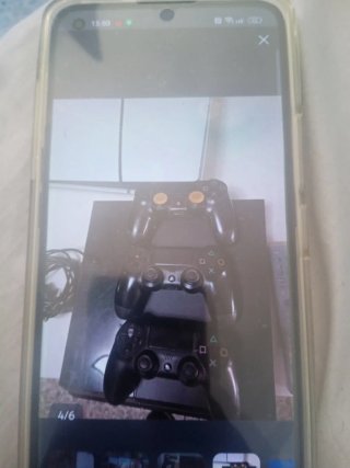 PS4 (PlayStation 4) con 1 mando y 10 juegos