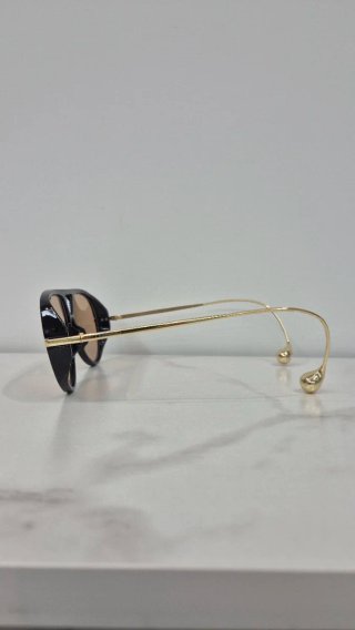 Occhiali da Sole con orecchino tipo Bottega Veneta