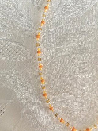 Collana perline arancioni e oro