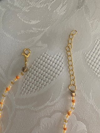 Collana perline arancioni e oro