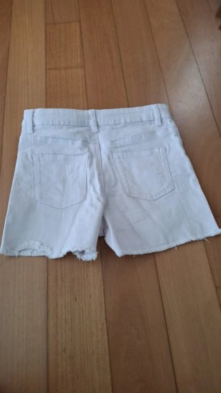 Calções brancos de ganga com franjas