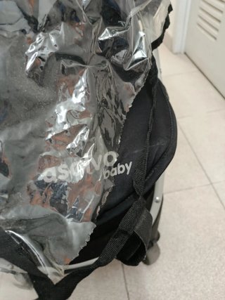 Silla de paseo plegable con plástico de lluvia
