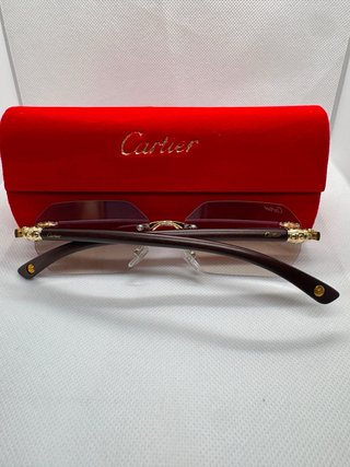 Gafas de sol Cartier marrones y doradas