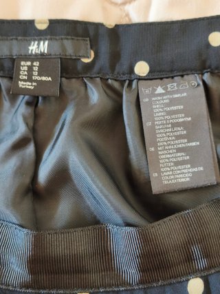 Falda plisada de lunares, de color negro - beige
