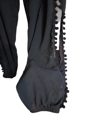 Pantalón playero negro con pompones