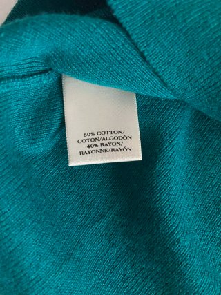Jersey ajustado de punto teal con cuello en V