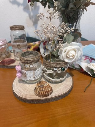 Centros de mesa rústicos con flores y conchas