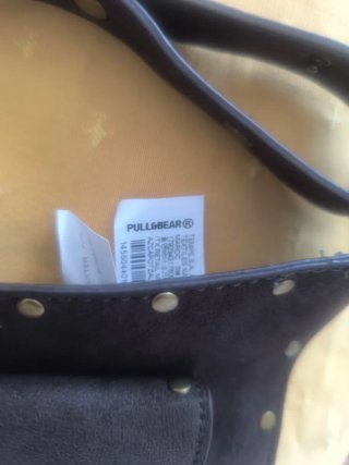 Riñonera cuero Pull and Bear tachuelas