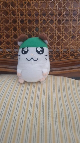 Peluche criceto con cappello verde
